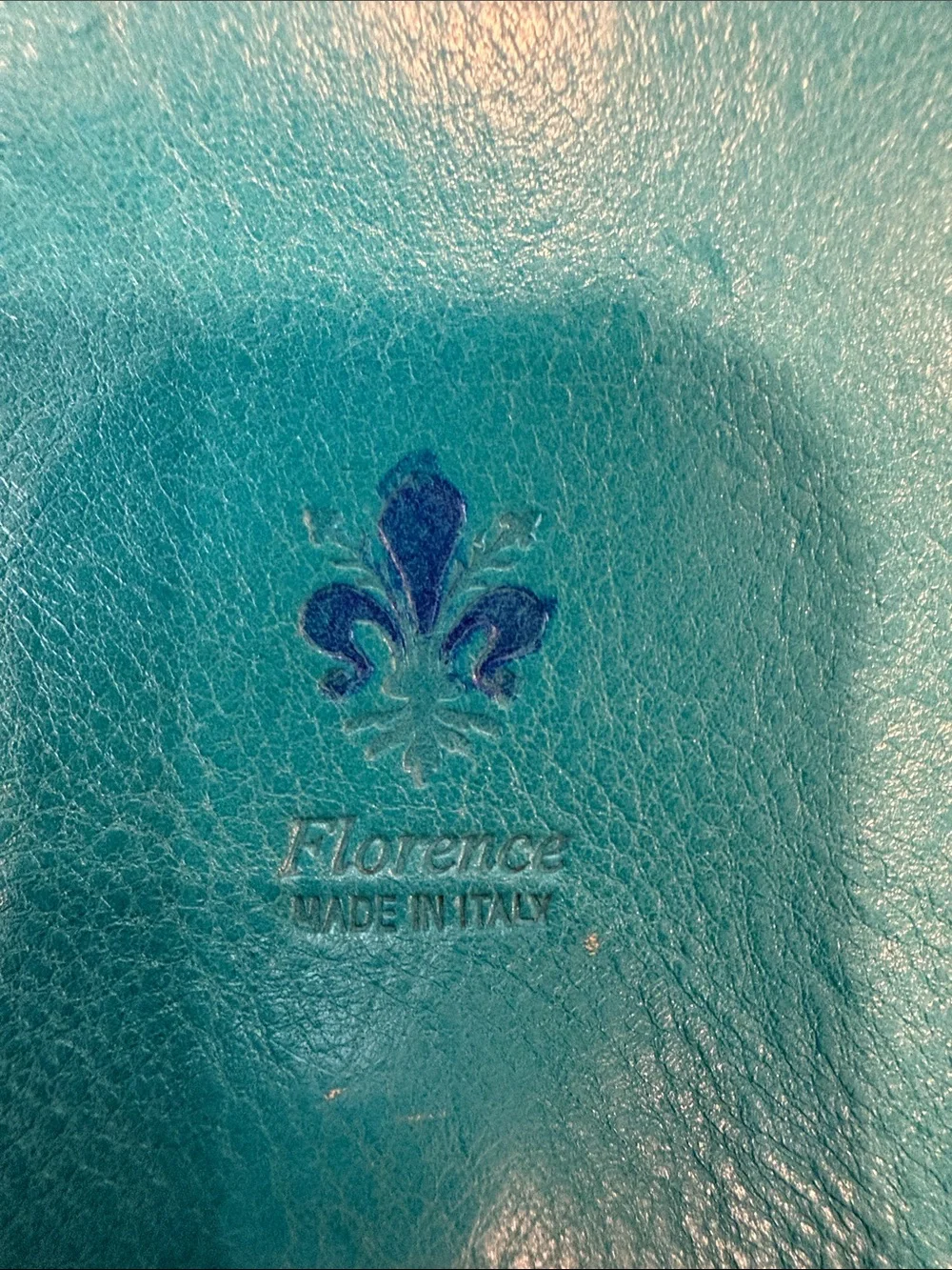 Vintage Florence Made in Italy genuine leather crossbody saddle bag in teal.